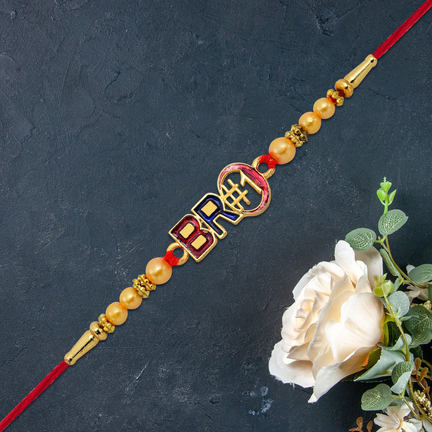Bro 1 Rakhi With Golden Beads  Enamel Finish Bro 1 Rakhi With Golden Beads  Enamel Finish